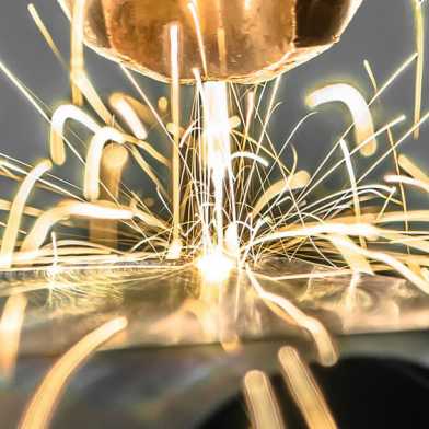 Image of a laser cutting metal